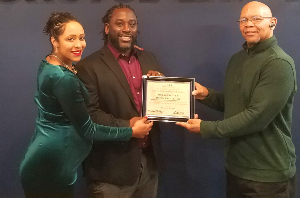 CCLP volunteer and pastor presents Certificate of Appreciation to volunteer attorney
