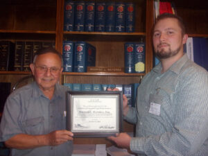 CCLP volunteer presents Certificate of Appreciation to volunteer attorney